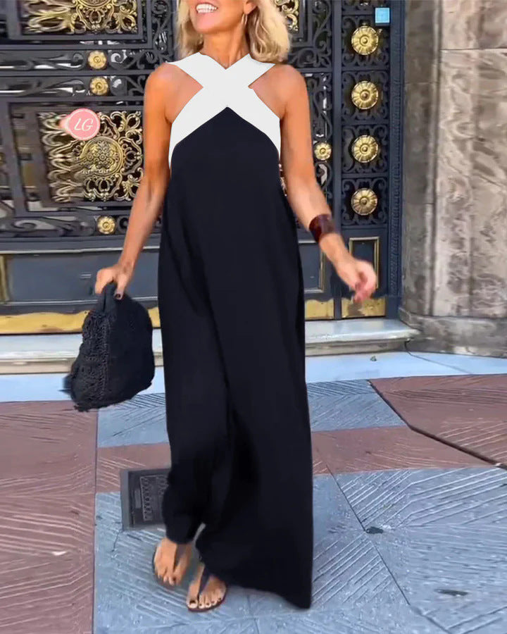 Stylish women's cross neck maxi dress, accessorized for an elegant evening party look.
