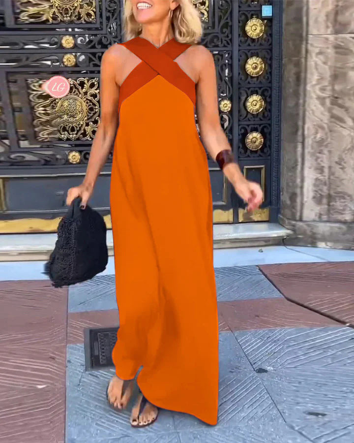 Women's long flowy cross neck maxi dress in motion, showing elegant drape for casual & evening.