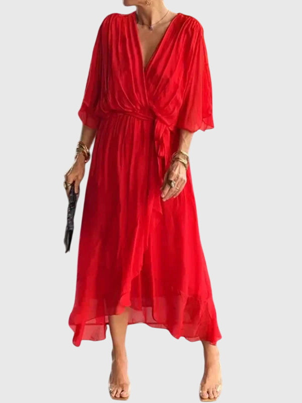 Beautiful women's flowy maxi dress with a V-neck, perfect for elegant summer wear.