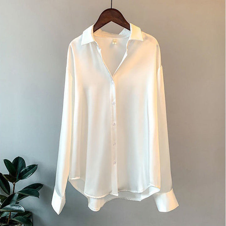 Women's elegant flowy ruffle blouse with long sleeves. Perfect for sophisticated chic fashion.