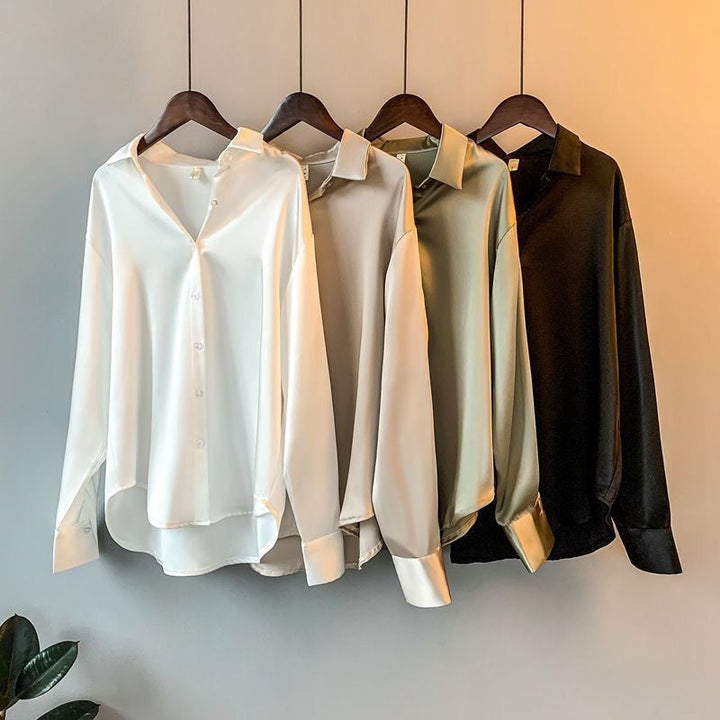 Sophisticated women's long sleeve ruffle top, ideal for elegant office wear or a dressy evening out.