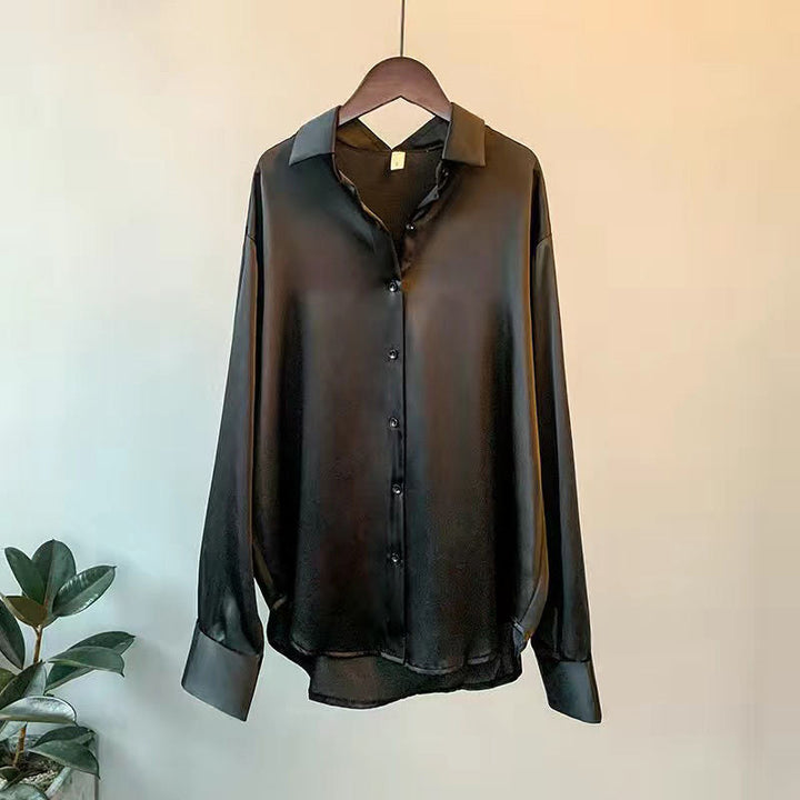 Fashionable flowy women's blouse with elegant ruffles. Great for comfortable spring or fall sophisticated style.