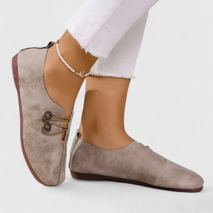 Women's elegant foldable loafers with elastic button closure, perfect for travel and on-the-go comfort.