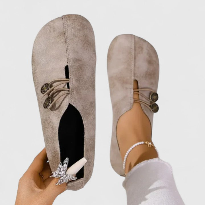 Easy slip-on women's casual loafers, designed for comfort with a foldable body and elastic button closure.