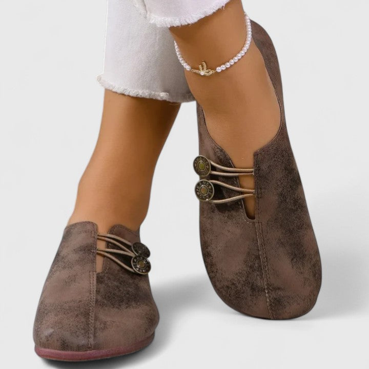 Elegant women's foldable travel flats, chic and comfy on-the-go footwear with a secure elastic button.
