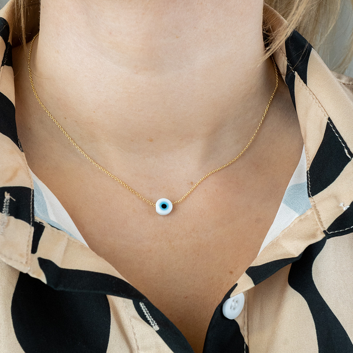 Stylish women's glossy Nazar necklace, a spiritual protection amulet. Elegant evil eye jewelry, perfect gift.