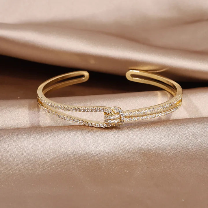Beautiful gold knot crystal bangle, an elegant and sparkling women's accessory.
