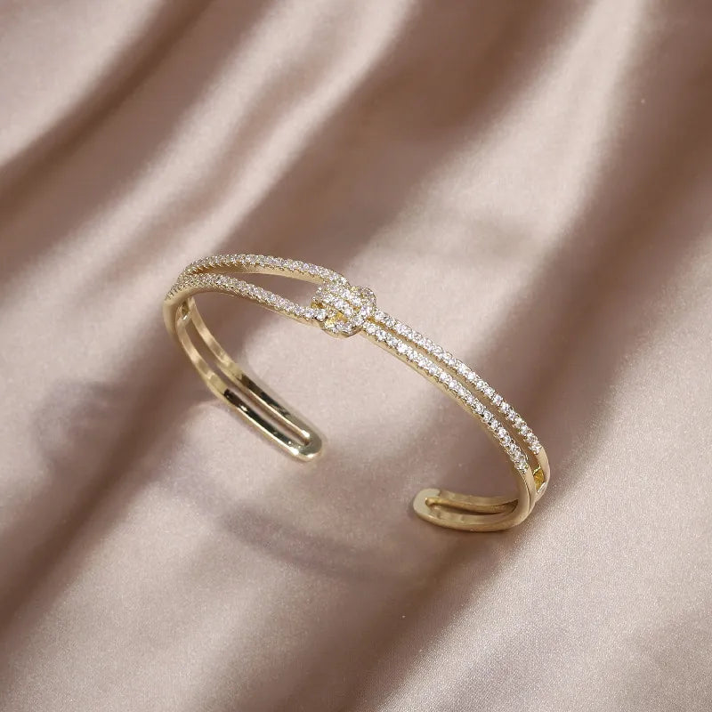 Chic women's gold knot crystal bangle, a must-have fashion jewelry accessory.