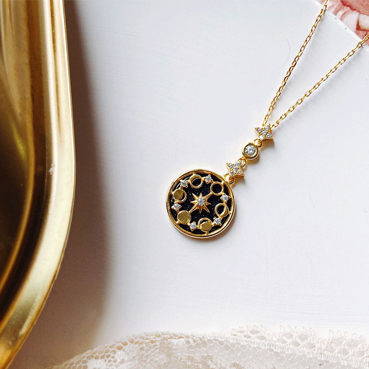 Gold plated Divine Totem pendant necklace for women, a celestial and elegant jewelry accessory.