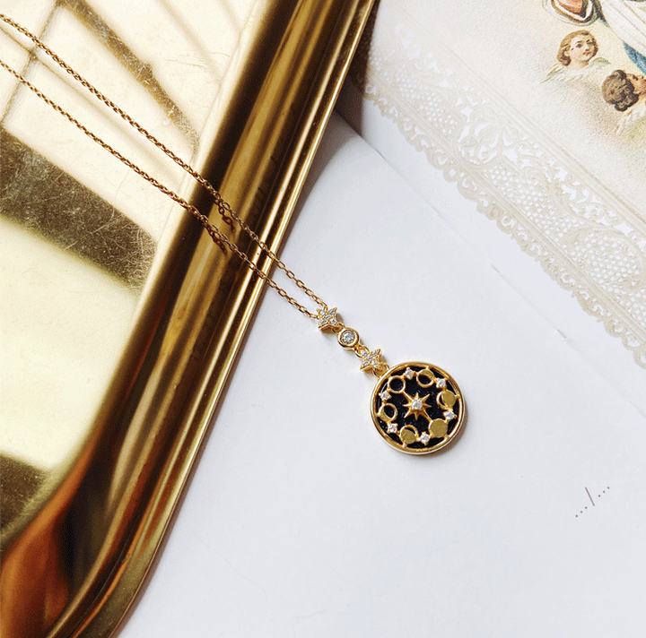 Close-up of gold plated Divine Totem pendant on an adjustable women's celestial necklace.