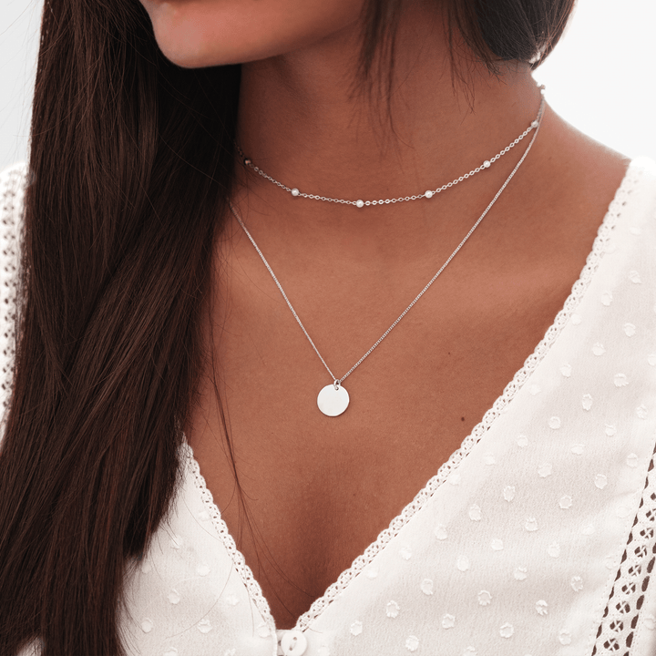 Chic women's gold plated layered necklace with two medallions. Dainty adjustable jewelry, perfect fashion accessory.