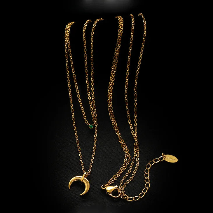 Beautiful green diamond double crescent moon necklace, a stunning and elegant accessory for women.