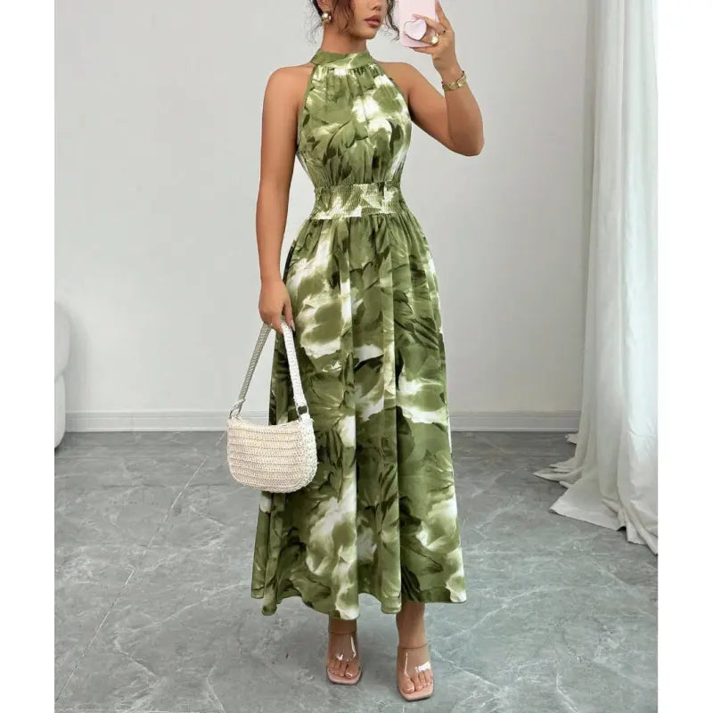 Women's elegant halter neck maxi dress with smocked waist & flowing skirt. Perfect for summer vacations or parties.