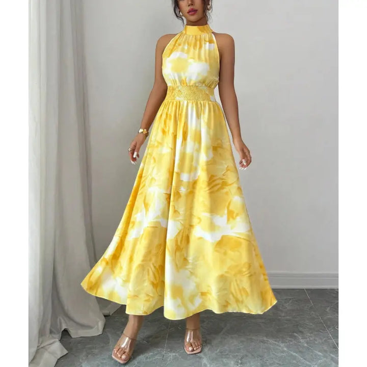 Flowing women's halter neck maxi dress with a flattering smocked waist. Stylish summer vacation and party attire.