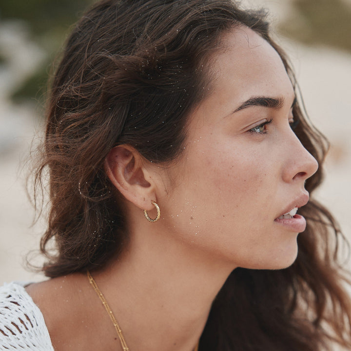 Simple yet elegant hammered gold hoop earrings, gold plated for women's everyday fashion.
