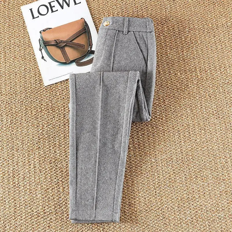 Stylish women's herringbone dress pants, high-waisted, versatile for work or casual chic outfits.