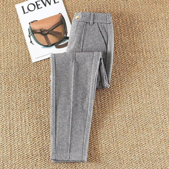 Stylish women's herringbone dress pants, high-waisted, versatile for work or casual chic outfits.