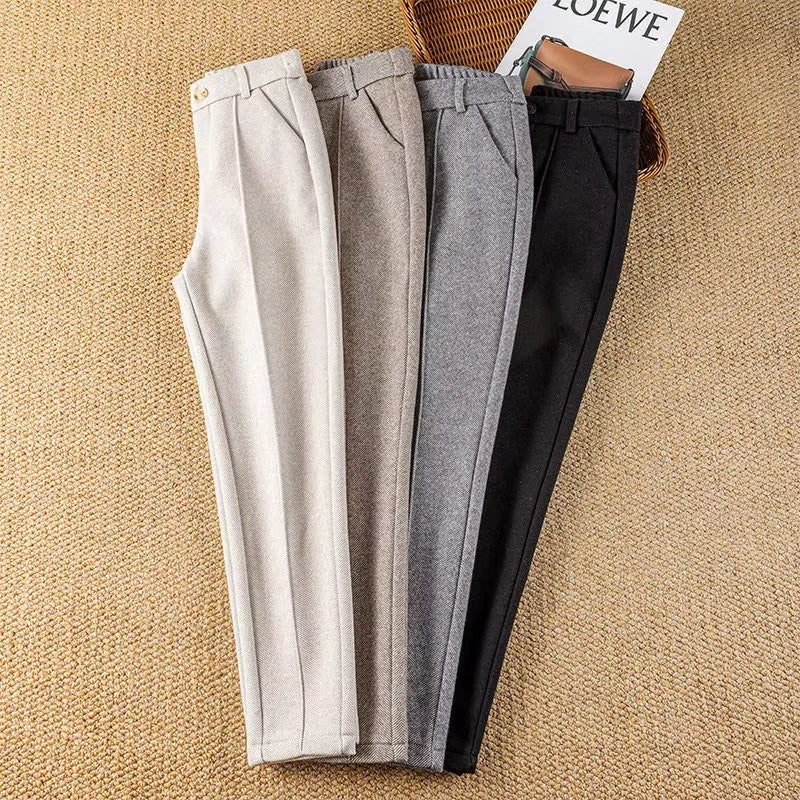 Back view of elegant women's herringbone dress pants, highlighting the sleek pencil fit.
