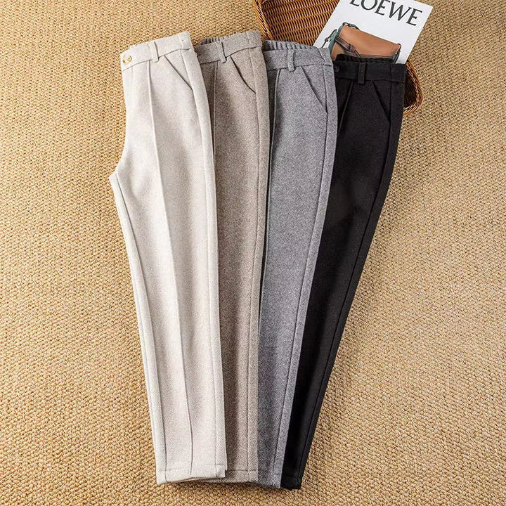 Back view of elegant women's herringbone dress pants, highlighting the sleek pencil fit.