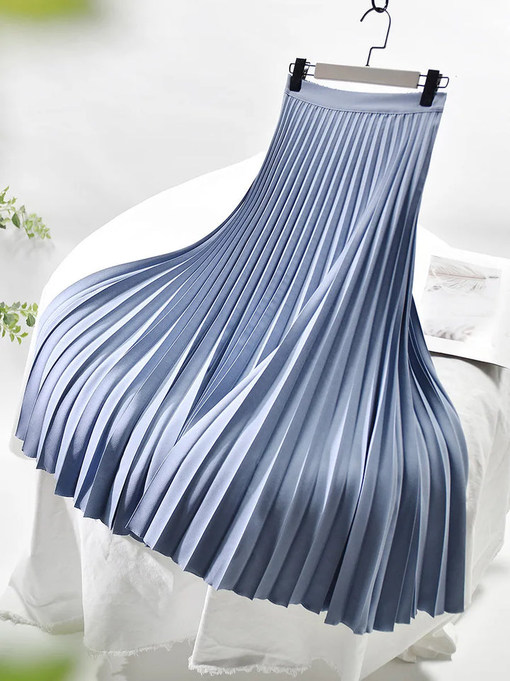 Beautiful women's elegant pleated midi skirt with a high waist, offering versatile, chic fashion and a flowy look.