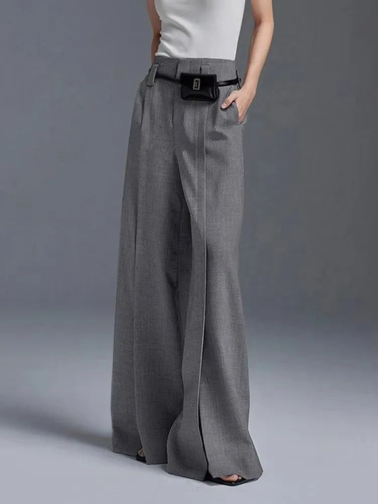 Stylish women's high-waisted wide-leg pants, highlighting their elegant drape, comfort, and front slit design.