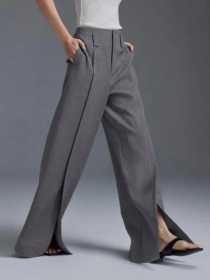 Elegant women's high-waisted wide-leg pants, comfortable office wear with a modern front slit. Casual chic.