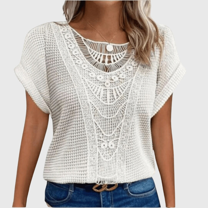 Delicate lace sleeves on an elegant women's Ibiza style blouse, perfect for fashionable summer wear.