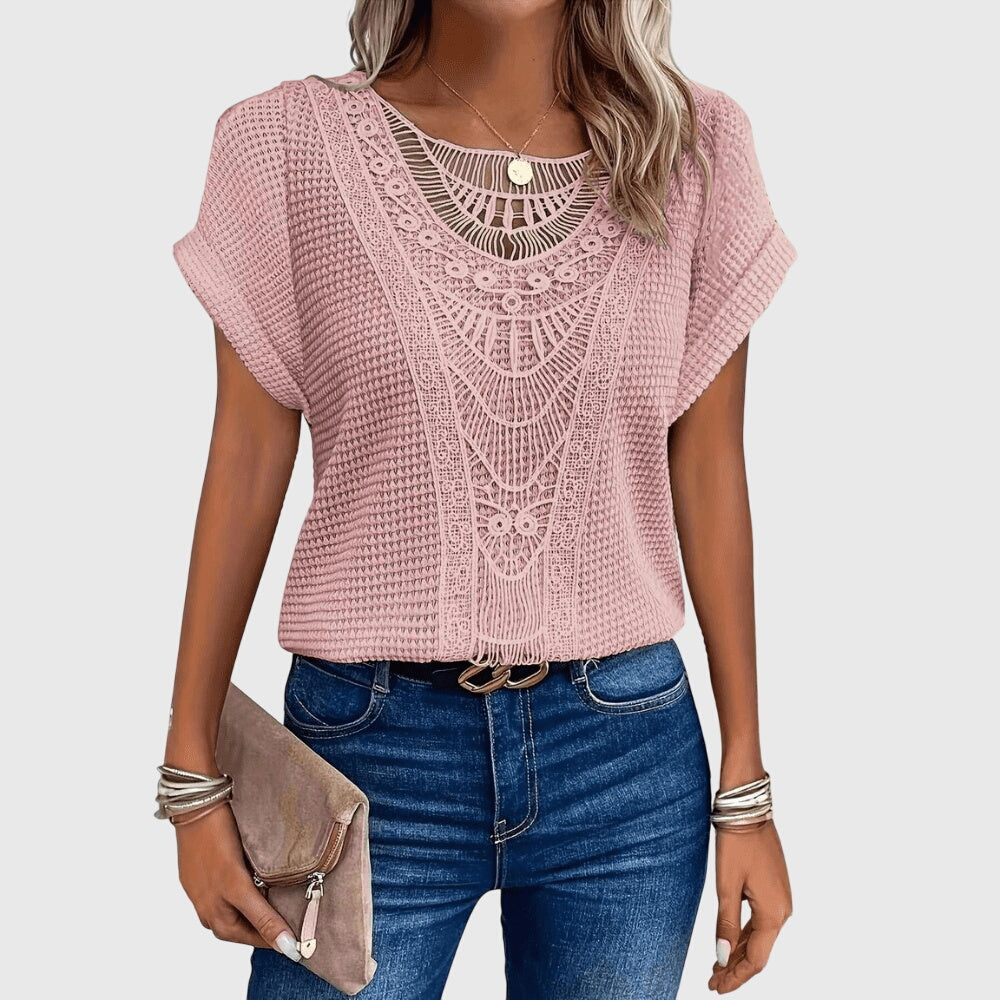 Close-up of intricate lace detail on an elegant women's Ibiza style blouse, offering casual chic for summer.