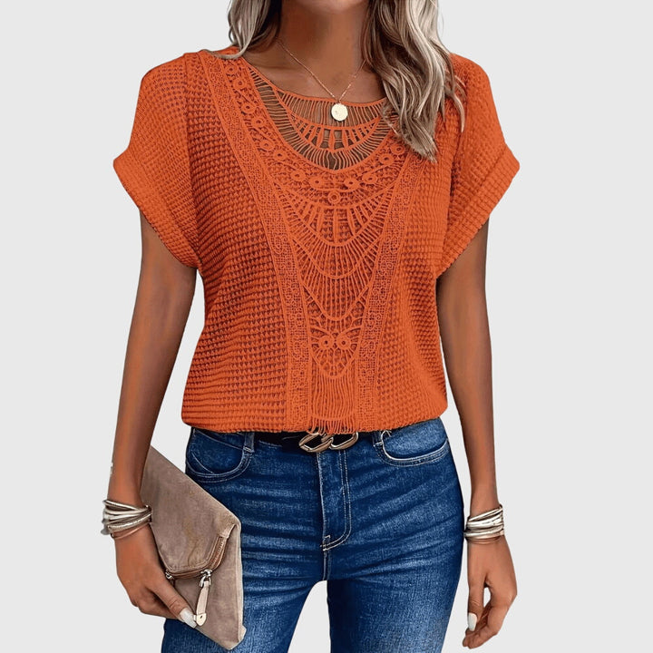 Elegant women's Ibiza style blouse from the back, showcasing subtle lace details. A casual chic top for summer.