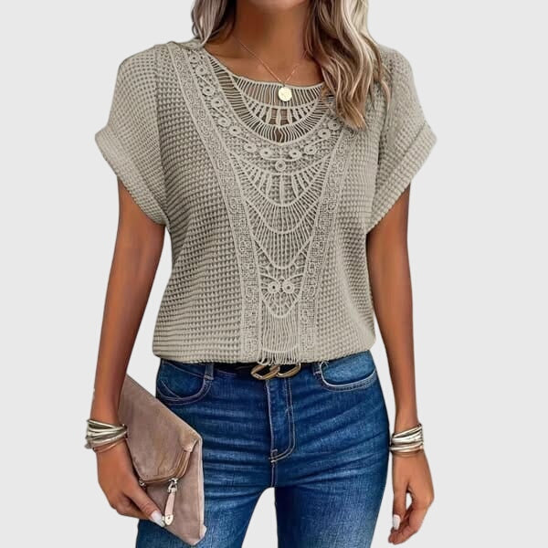 Chic women's blouse in Ibiza style with delicate lace details, a versatile summer fashion piece for elegant resort wear.