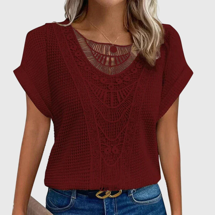 Elegant women's lace blouse, Ibiza style, offering a sophisticated look for resort and summer wear. Flattering fit.
