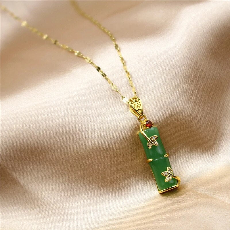 Stunning green jade amulet pendant on an elegant white necklace for women.