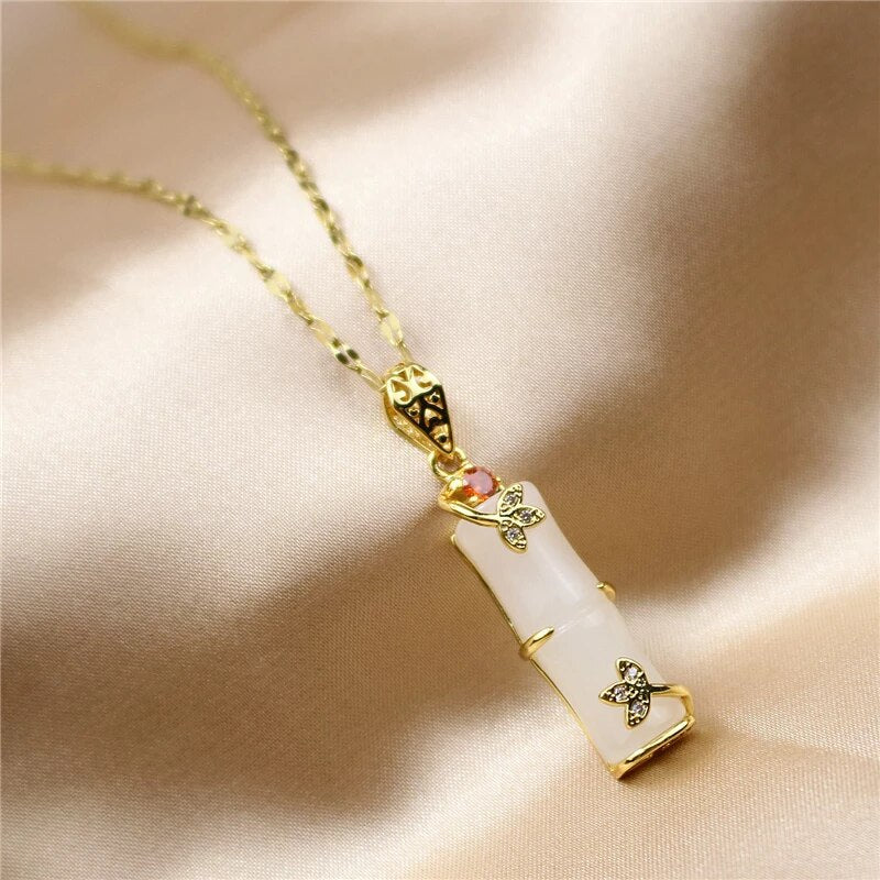 Women's stunning green jade pendant necklace, an elegant amulet jewelry piece.