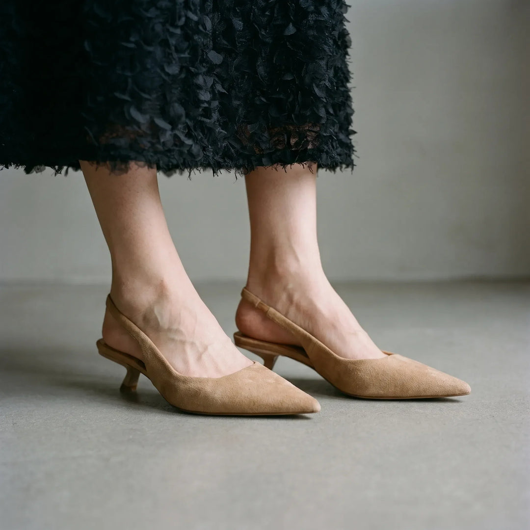 Women's elegant kitten heel slingback sandals with pointed toe, perfect for formal or office wear.