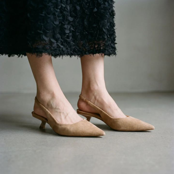 Women's elegant kitten heel slingback sandals with pointed toe, perfect for formal or office wear.