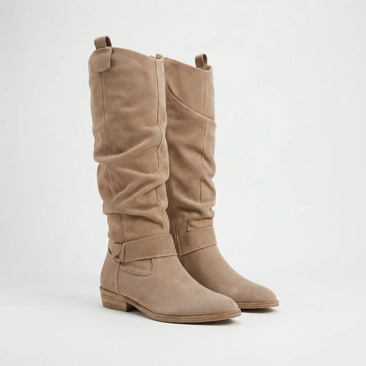 Comfortable women's winter boots, knee-high style with a low block heel and stylish side zipper detail.