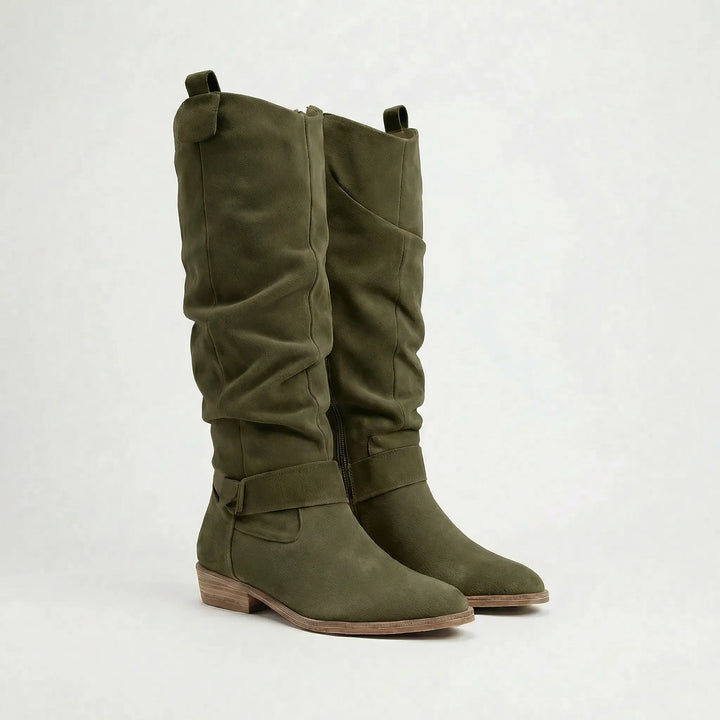 Elegant women's knee-high boots in a versatile design, ideal for everyday wear and fall/winter outfits.