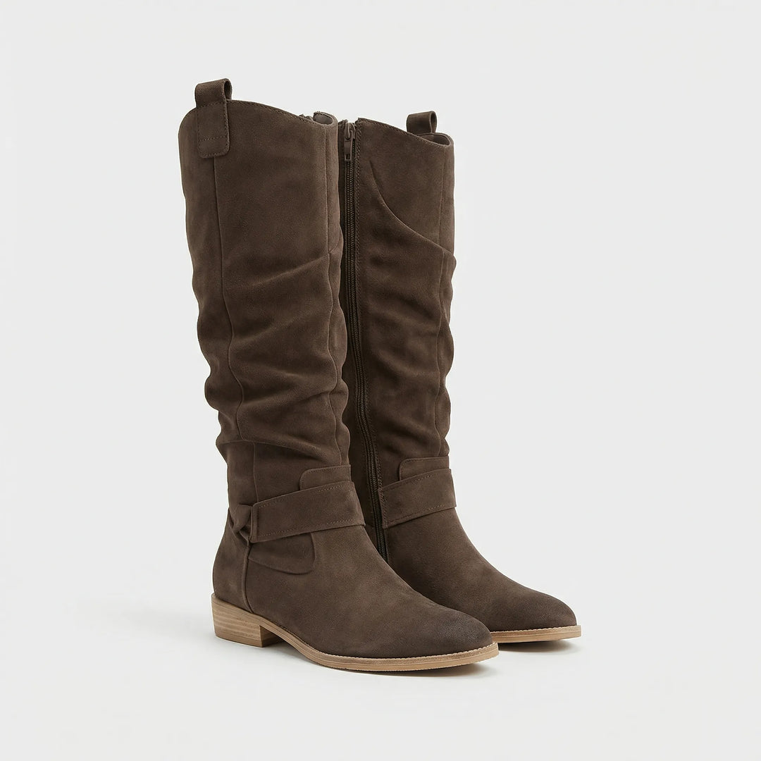 Stylish knee-high boots for women featuring a graceful bow detail, block heel, and convenient side zipper.