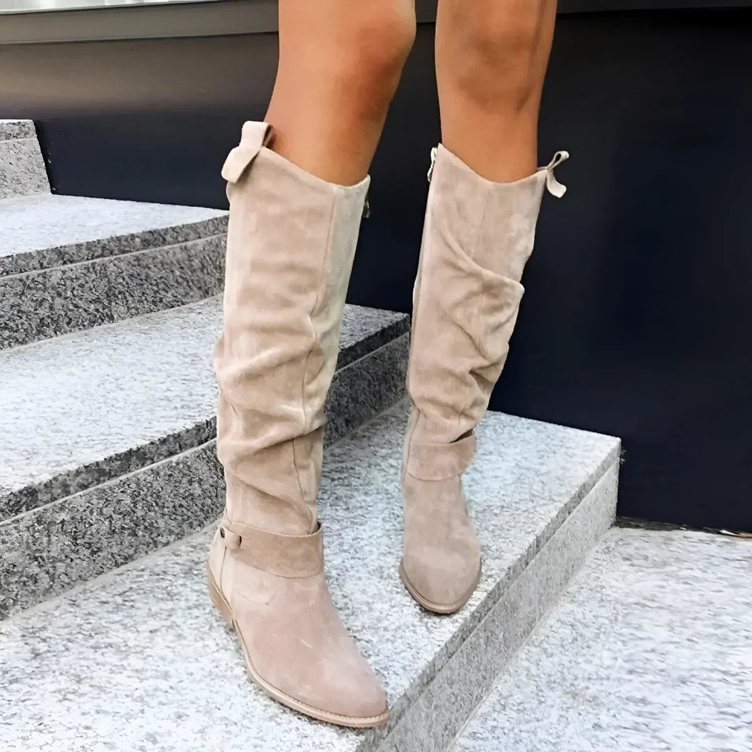 Sophisticated women's knee-high boots, elegant silhouette & practical side zipper, essential autumn footwear.