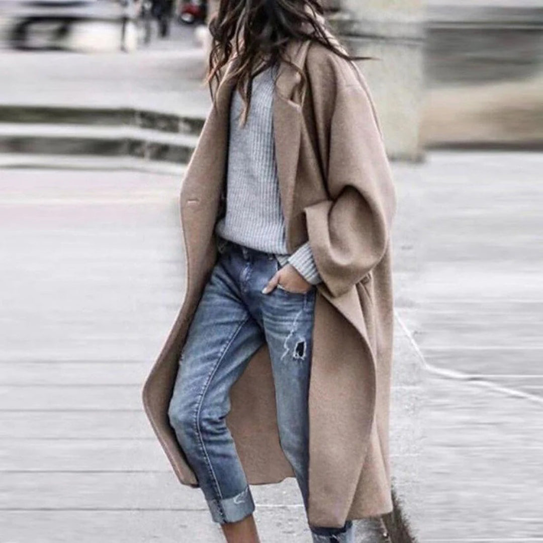 Warm women's knee-length winter coat featuring an elegant large collar, ideal for cold weather outerwear.