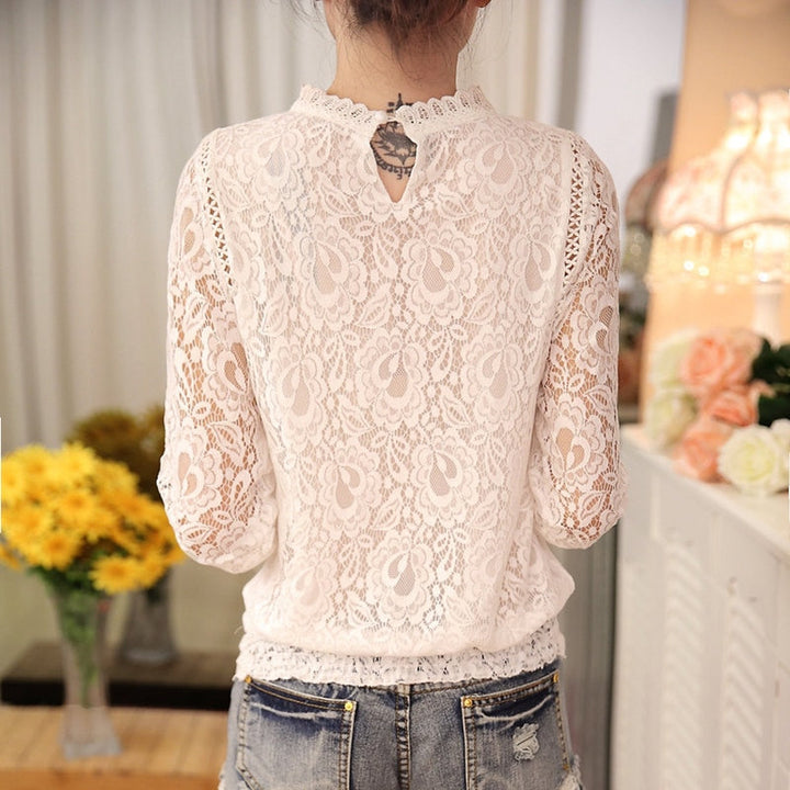 Stylish women's lace top with long sleeves, elegant floral lace, and a stand-up collar for sophisticated fashion.