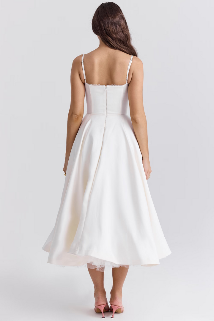 Women's sleeveless midi dress featuring a lace-trim corset, sweetheart neckline, tulle hem, and pockets.