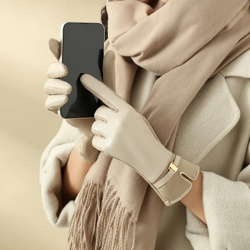 Women's warm leather touchscreen gloves. Elegant winter fashion accessory for cold weather.
