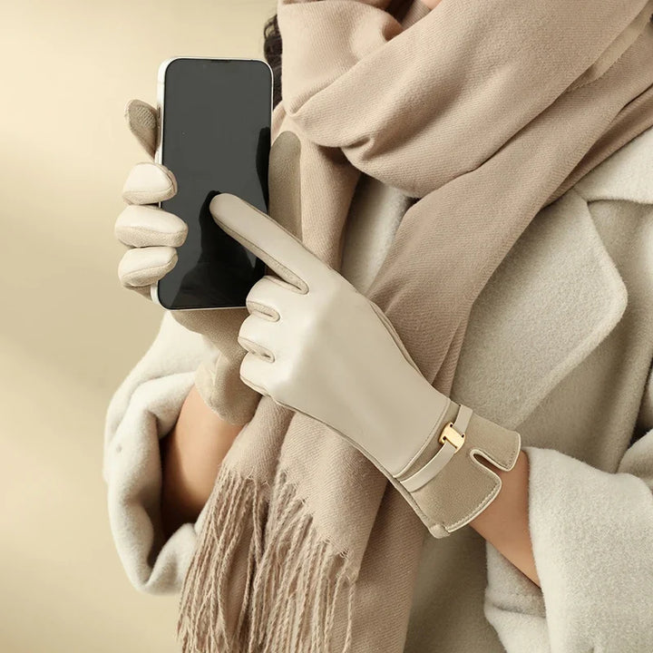 Women's warm leather touchscreen gloves. Elegant winter fashion accessory for cold weather.