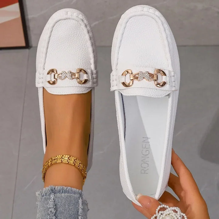 Women's elegant loafers with sparkling crystal chain detail, perfect for stylish outfits.
