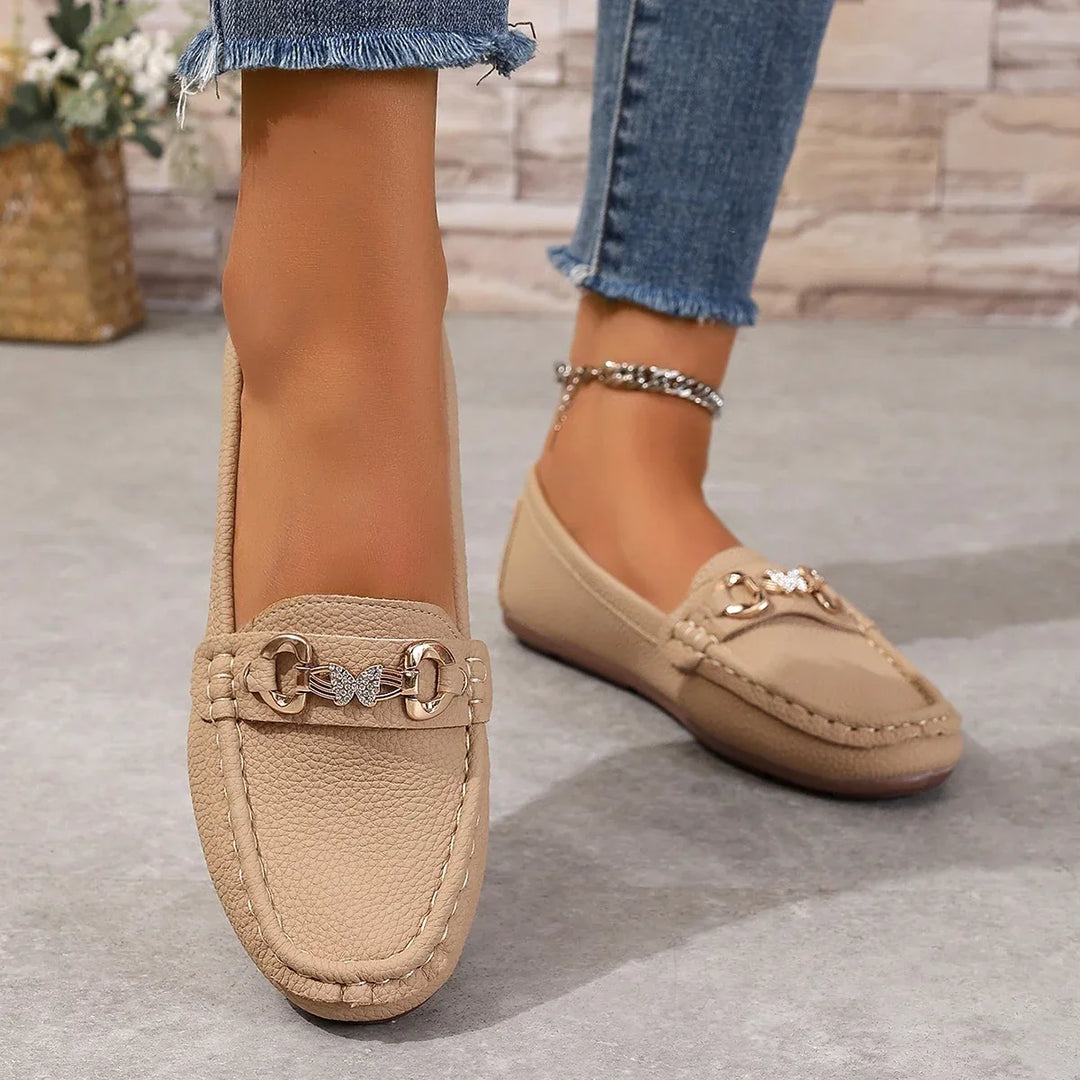 Elegant women's slip-on loafers with a distinctive crystal chain, comfortable for daily wear.