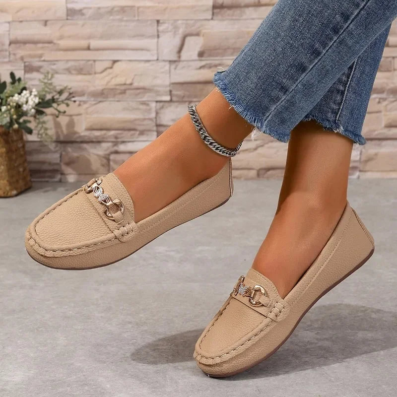 Front view of stylish women's formal loafers, intricate crystal chain detail adding sophistication.