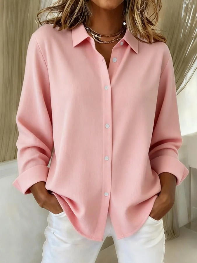 Comfortable women's blouse with a chic, elegant design. A versatile long-sleeve top for everyday or office attire.