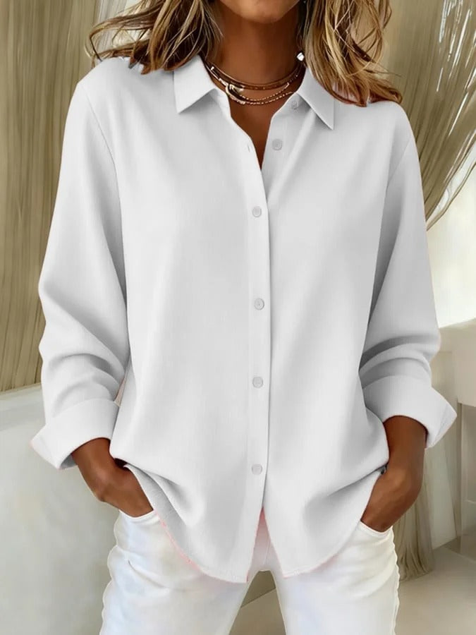 Soft, elegant women's long-sleeve blouse offering comfortable wear and a versatile, chic look for any occasion.