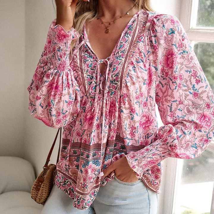 Women's elegant long-sleeve blouse with vibrant floral print, perfect for spring & summer fashion.